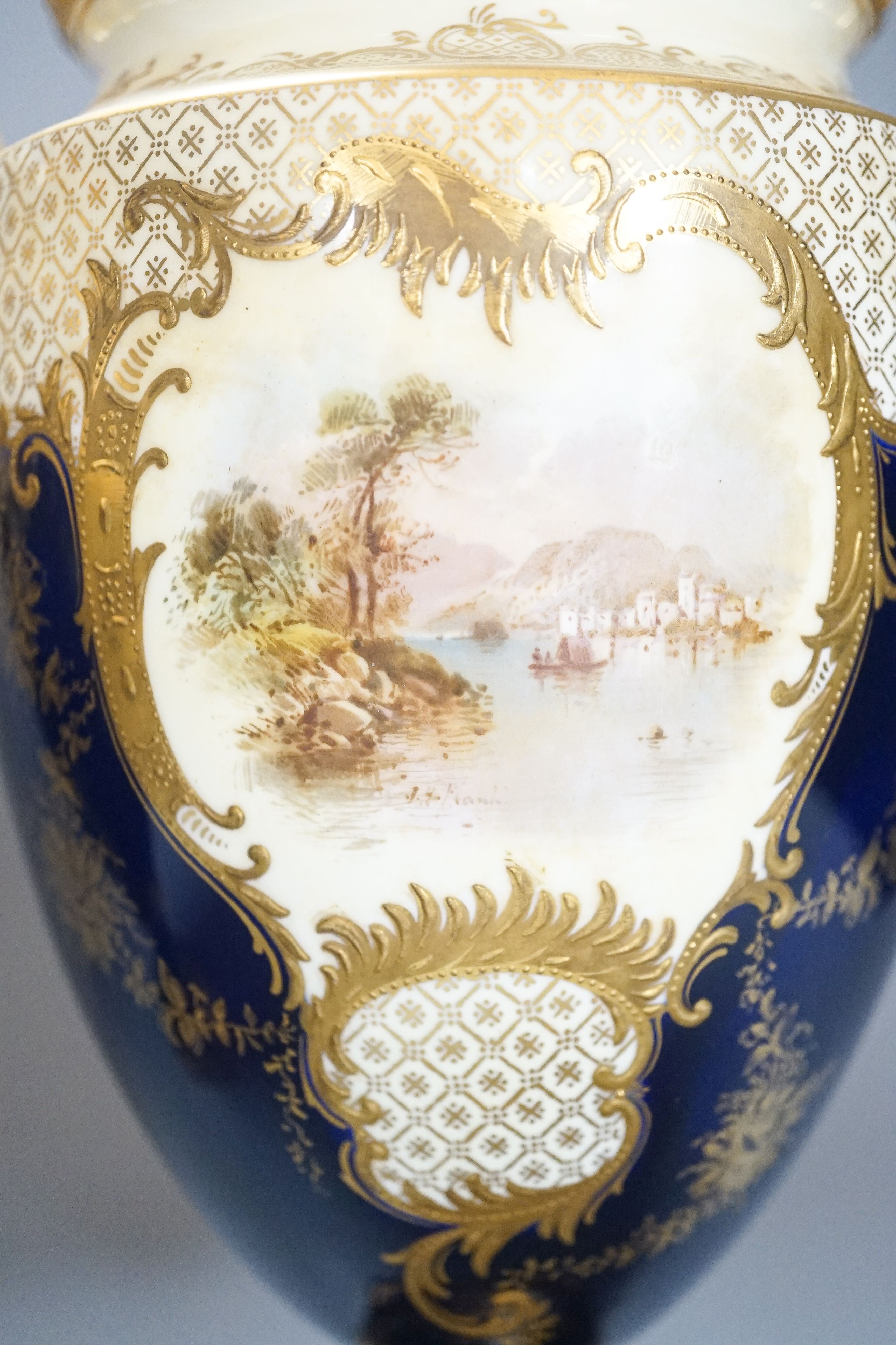 A pair of large Coalport landscape painted vases and covers, c.1900, 30cm